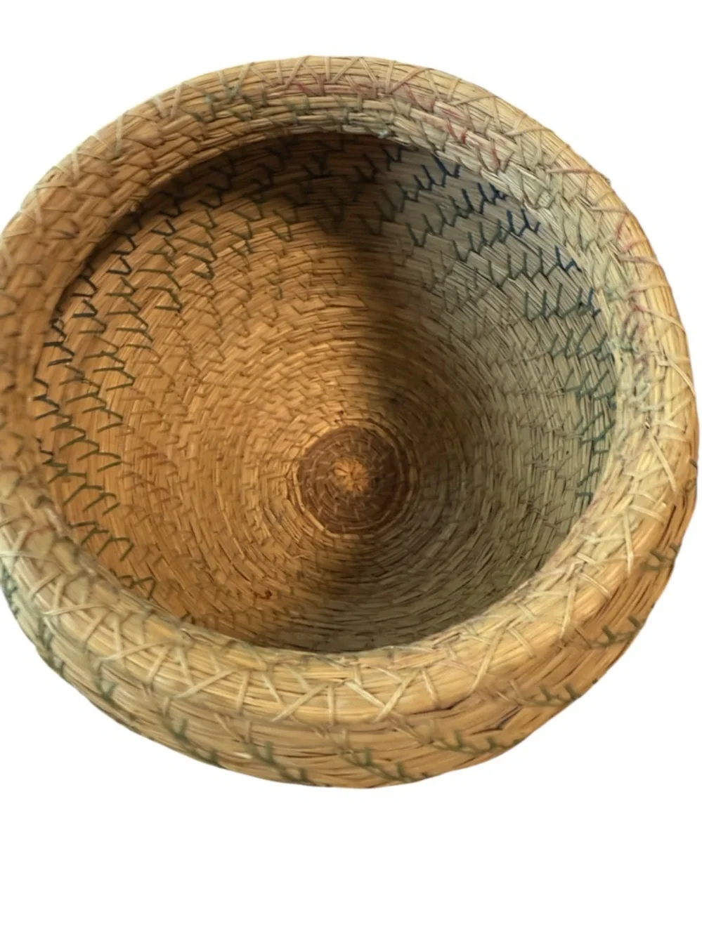 vintage Native American style pine needle basket, similar to those identified